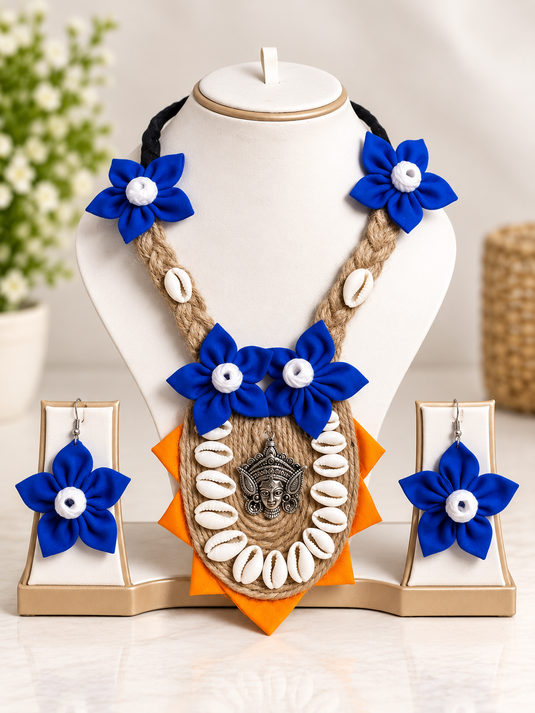 GARIMAS blue floral handmade jute necklace and matching earrings on jewellery display
