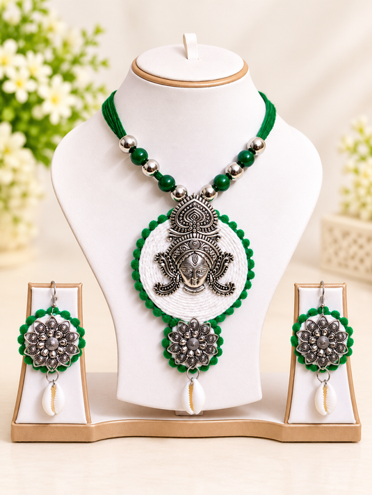 GARIMAS green and silver-tone ethnic necklace set with round pendant and matching earrings