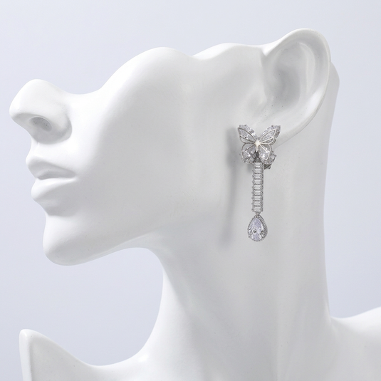 GARIMAS handmade Turkish butterfly drop earrings displayed on a white mannequin.