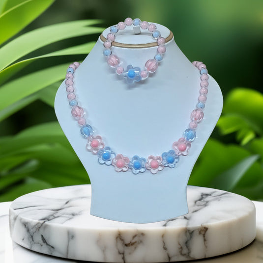 Beaded necklace and bracelet set on a  stand