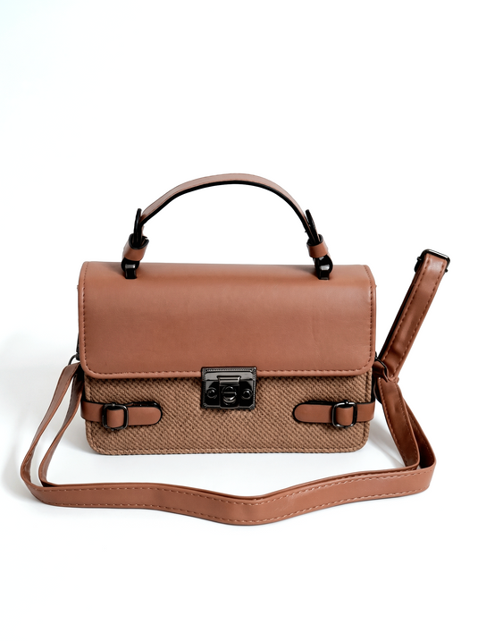 GARIMAS cognac brown faux leather satchel handbag on a matte white background