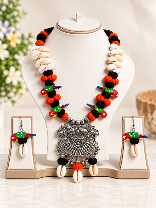 GARIMAS tribal bird charm necklace set with shell drops and matching bird charm earrings