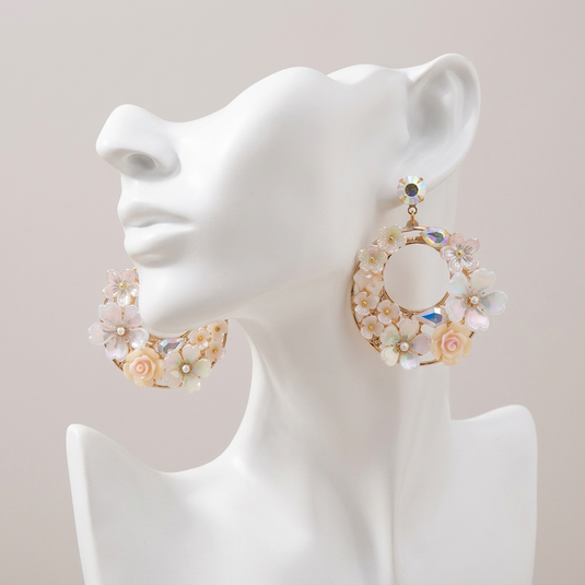 GARIMAS pastel floral Turkish drop earrings displayed on a matte white mannequin.