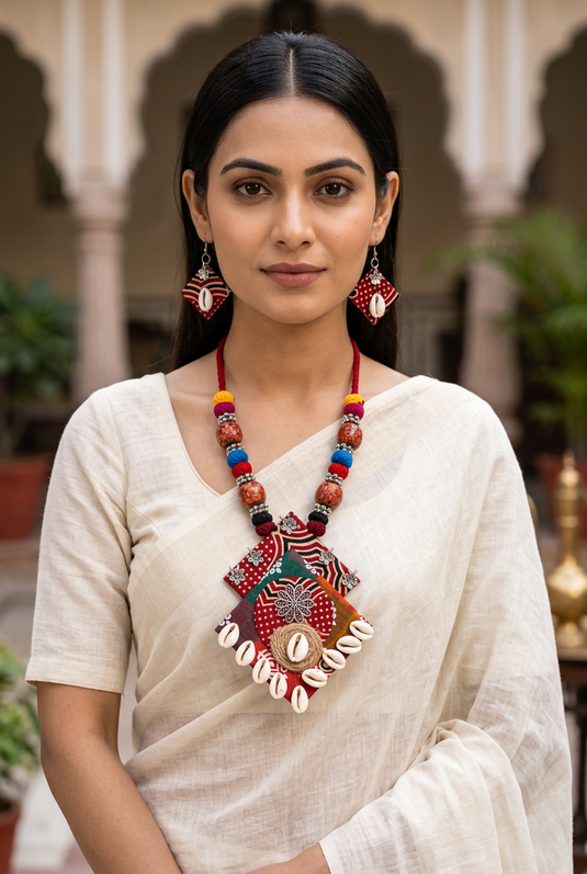 Indian woman wearing GARIMAS colourful patchwork necklace and matching earrings