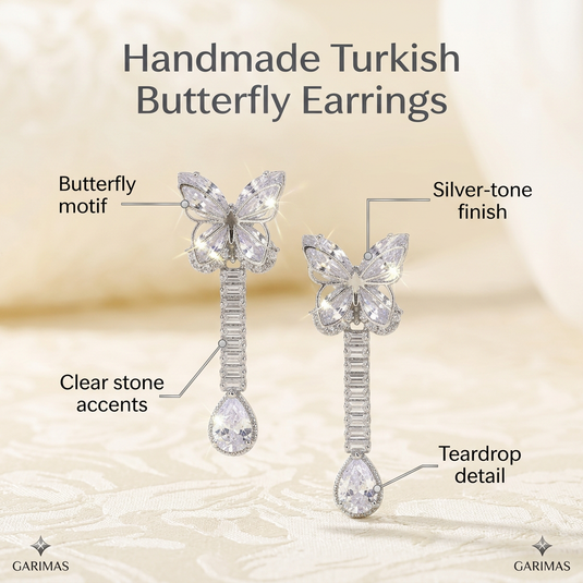Close-up product view of handmade Turkish butterfly drop earrings by GARIMAS.