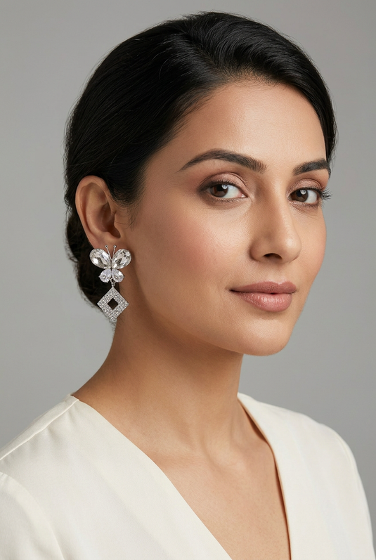 Indian woman wearing silver butterfly earrings