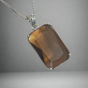 Garimas smoky yellow pendant necklace with silver plating, featuring a rectangular CZ stone centerpiece.