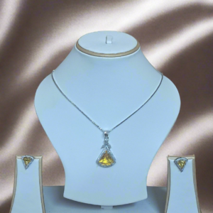 Exquisite Aqua Yellow CZ studded pendant set on display with silver plated chain by Garimas against elegant backdrop.