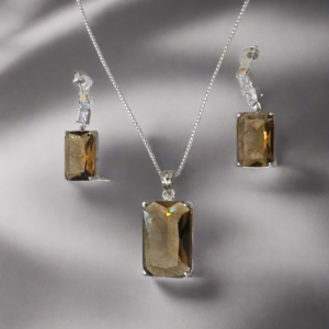 Smoky yellow pendant set with matching earrings and silver-plated chain by Garimas, showcasing elegance and style.