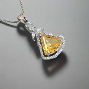 Aqua yellow CZ studded pendant set by Garimas, showcasing a sparkling yellow gem on a silver-plated chain.