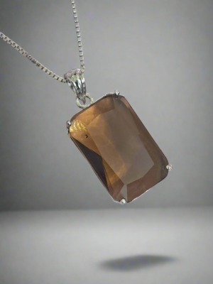 Garimas smoky yellow pendant necklace with silver plating, featuring a rectangular CZ stone centerpiece.