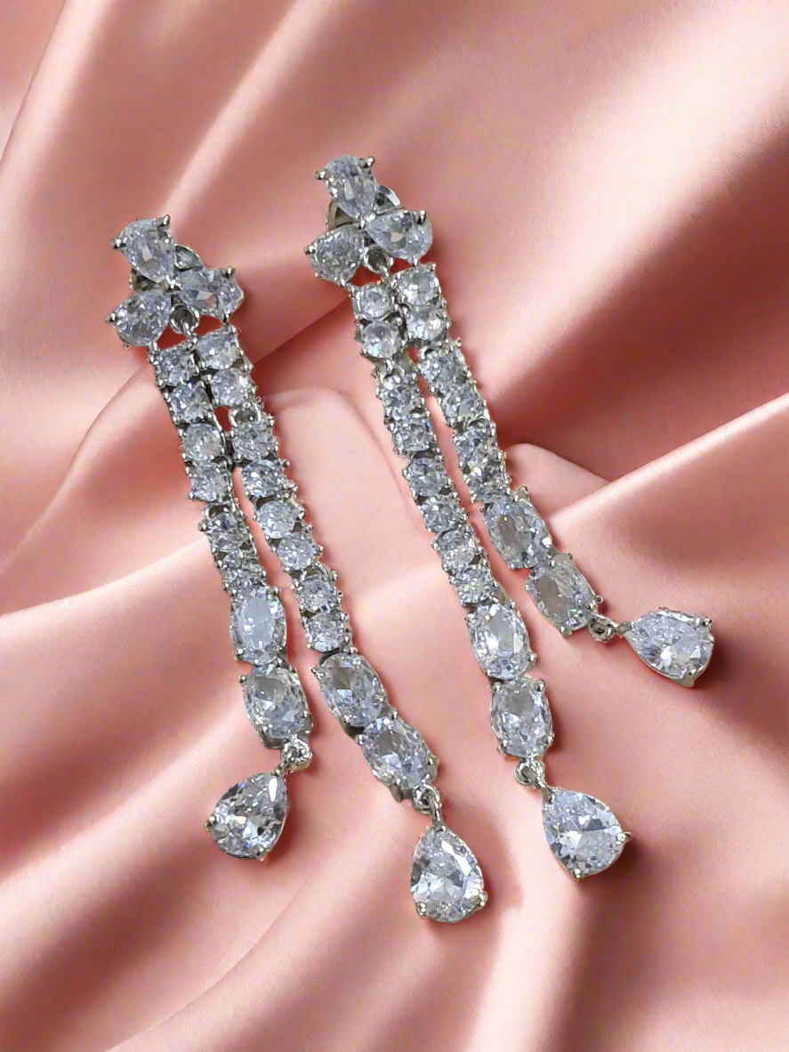background-editor_output_694cf01b-9e85-452d-bf00-2f9e90d74c0c Silver-Plated Cubic Zirconia Studded Contemporary Drop Earrings | Garimas